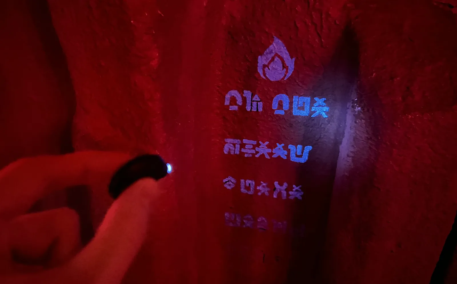 A kid revealing a clue on the wall